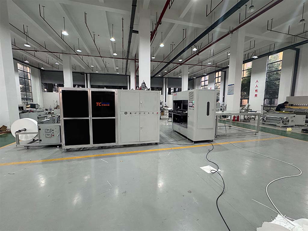 automated filter paper folding and adhesive application machine